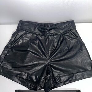 Synthetic leather shorts, with wide leg spring, soft and smooth fabric inside.